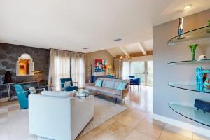 a living room with a couch and a table at 10 Pines - Sarasota Bay in Sarasota