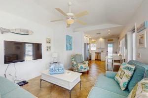 a living room with a couch and a table at Sea's The Day in Anna Maria