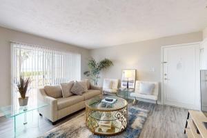 a living room with a couch and a glass table at Carlton Arms View B1 # A in Bradenton