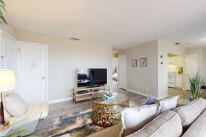 a living room with a couch and a tv at Carlton Arms View B1 # A in Bradenton