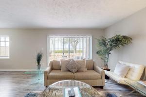 a living room with a couch and a glass table at Carlton Arms View B1 # A in Bradenton