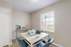 a dining room with a table and chairs and a window at Carlton Arms View B1 # A in Bradenton +48 photos