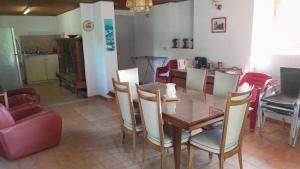 a dining room with a table and chairs at Maison rustique in Devesset
