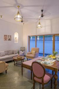 a living room with a table and chairs at Villa Eden 3BHK in Assagao +9 photos
