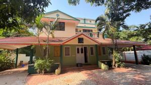 a house with green and pink at Gravity Groups Core - Pannai veedu in Puducherry Airpoert