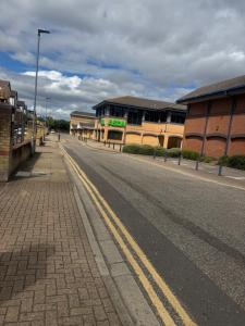 an empty street in front of a building at Beautiful Double room in Peterborough +10 photos