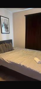 a bedroom with a bed with a white mattress at Studio in Fjellhammar
