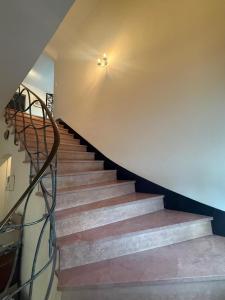 a staircase in a house with a stair case at Cosy Carré in Sélestat +26 photos