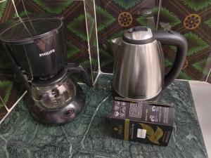 a coffee maker and a blender on a counter at Stupas, Temples and Coffee 2BR Flat in Kathmandu in Kathmandu