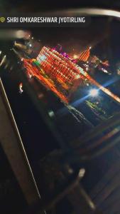 a view of a city at night with lights at Hotel sawariya in Godarpura