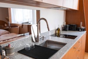 a kitchen counter top with a sink and a sink at Studio Design Paris 20 min RER A in Nogent-sur-Marne +6 photos