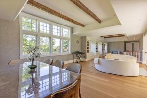a living room with a white couch and a table at Greycliff Mohonk Preserve Getaway in New Paltz