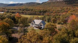 an aerial view of a house in the middle of a forest at Greycliff Mohonk Preserve Getaway in New Paltz