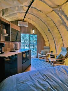 a room with a bed in a dome shaped room at Fenlea Resort Glamping Cocoon in Hampton