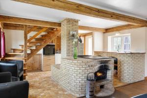 a living room with a brick fireplace in a house at SB137-Grasten-Dalsgardvej-12 in Gråsten