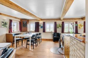 a dining room with a table and chairs at SB137-Grasten-Dalsgardvej-12 in Gråsten +13 photos