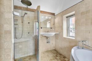a bathroom with a shower and a sink at SB137-Grasten-Dalsgardvej-12 in Gråsten