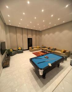 a living room with a ping pong table in it at دره العروس الشاطي in Jeddah