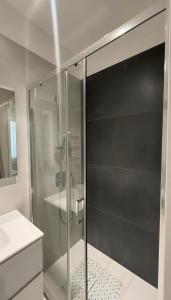 a glass shower in a bathroom with a sink at Casa Lanterna - Sottomarina in Chioggia