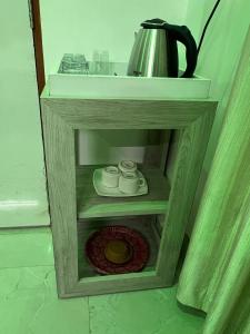 a wooden box with a coffee pot on top of it at Ramaya Retreat Ayodhya in Faizābād +16 photos