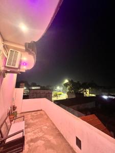 a night view of a balcony of a building at Ramaya Retreat Ayodhya in Faizābād
