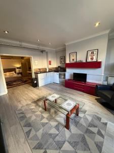 a living room with a couch and a coffee table at 12A Regency Square in Brighton & Hove