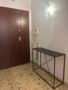 a black table in a room with a door at Residenza San Nicolò in Treviso +9 photos
