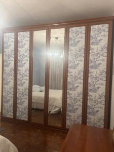 a room with sliding glass doors with a bed at Residenza San Nicolò in Treviso