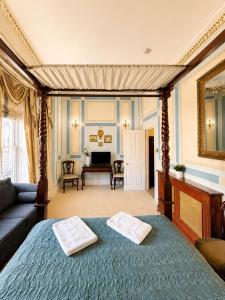 a bedroom with a bed and a living room at 12A Regency Square in Brighton & Hove