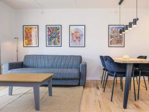 a living room with a couch and a table at Hals Apartment 100m from Beach in Hals +33 photos