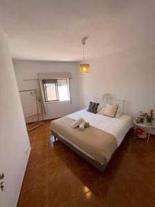 a bedroom with a large bed in a room at Pousada Mar de Calma in Montemor-o-Novo +40 photos