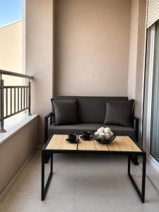 a living room with a couch and a table at apartment Danijela in Radanovići