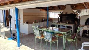 a dining room with a table and chairs in a kitchen at Dora's Sweet Home in Mytikas +21 photos