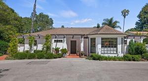 a white house with a driveway at Hedgerow Jewel Box in Santa Barbara