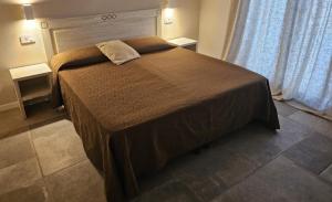 a bedroom with a large bed in a room at Villa Altea Boutique Hotel in Terranuova Bracciolini