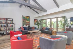 a large living room with couches and chairs at Casa Alegria in Santa Barbara