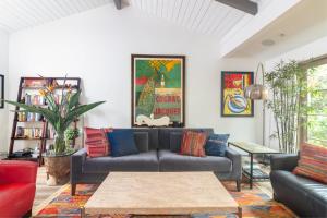 a living room with a couch and a table at Casa Alegria in Santa Barbara