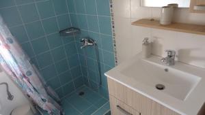 a bathroom with a shower and a sink at Isidoros House in Keramoti +43 photos