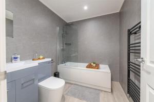 a bathroom with a white toilet and a shower at 1 bed flat in Wolverhampton city centre in Wolverhampton +10 photos