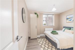 a bedroom with a bed and a window at 1 bed flat in Wolverhampton city centre in Wolverhampton