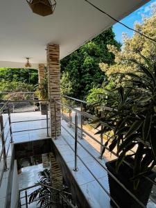a view from the balcony of a house with plants at Hostal La Bendición Buritaca in Santa Marta