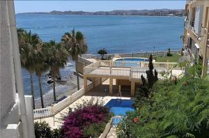 a view of the ocean from the balcony of a building at Dúplex Paradise above the sea in Benalmádena