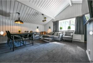 a living room with a table and a couch at Skistar Lodge Hemsedal in Hemsedal
