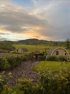 a view of a garden with two dome homes at Knockmany View Glamping in Augher