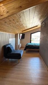 a room with two beds and a couch in it at Monic Apart Zefir in Mechelinki