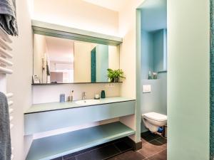 a bathroom with a sink and a toilet at La Terrasse in Sint-Idesbald +16 photos