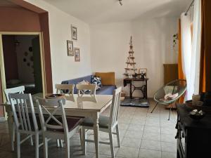 a dining room with a white table and chairs at Seaside secluded apartments Cove Skozanje, Hvar - 14899 in Gdinj