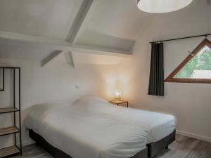 a bedroom with a white bed and a window at Lac Bleu 39 in Lacapelle-Marival +37 photos