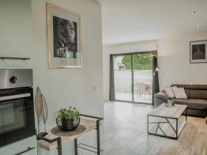 a living room with a couch and a table at Lac Bleu 39 in Lacapelle-Marival