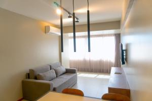 a living room with a couch and a table at Top Unique Maceió in Maceió